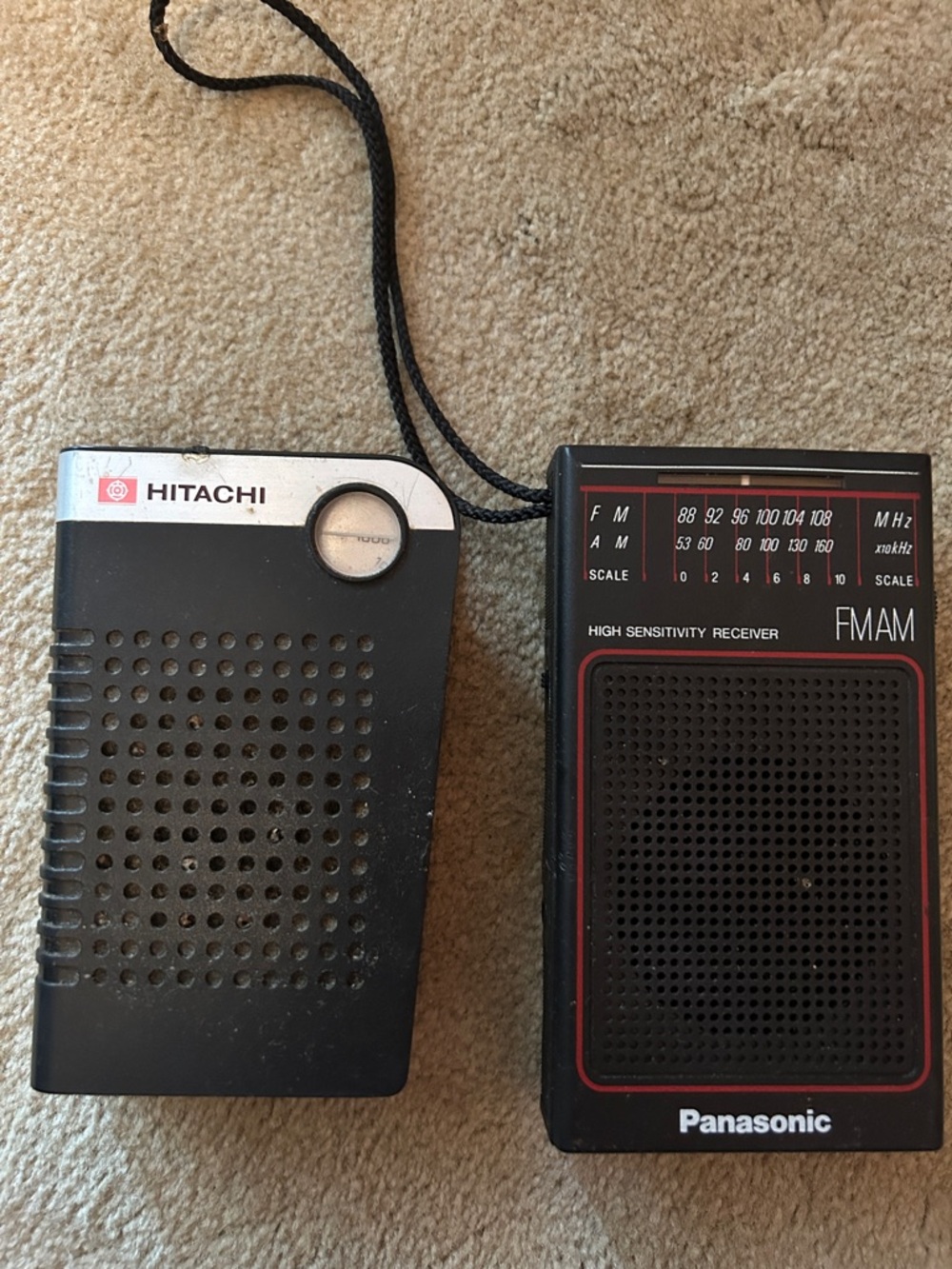 Vintage Black transistor radios.